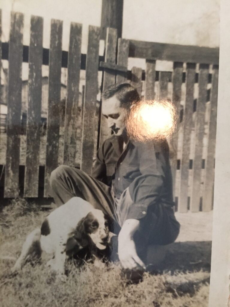 A man with his dog.